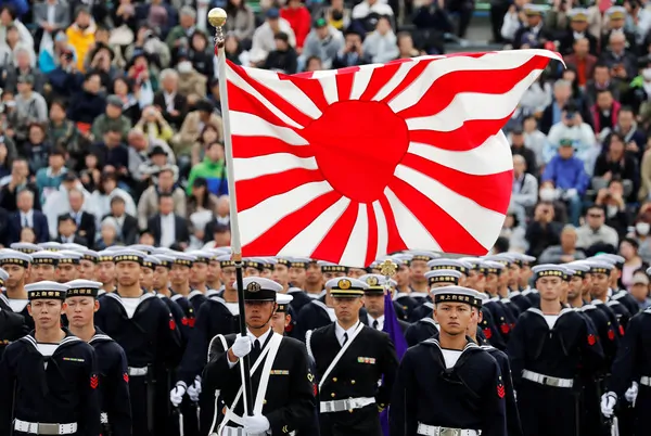 Modern Japanese Navy holding the rising sun flag