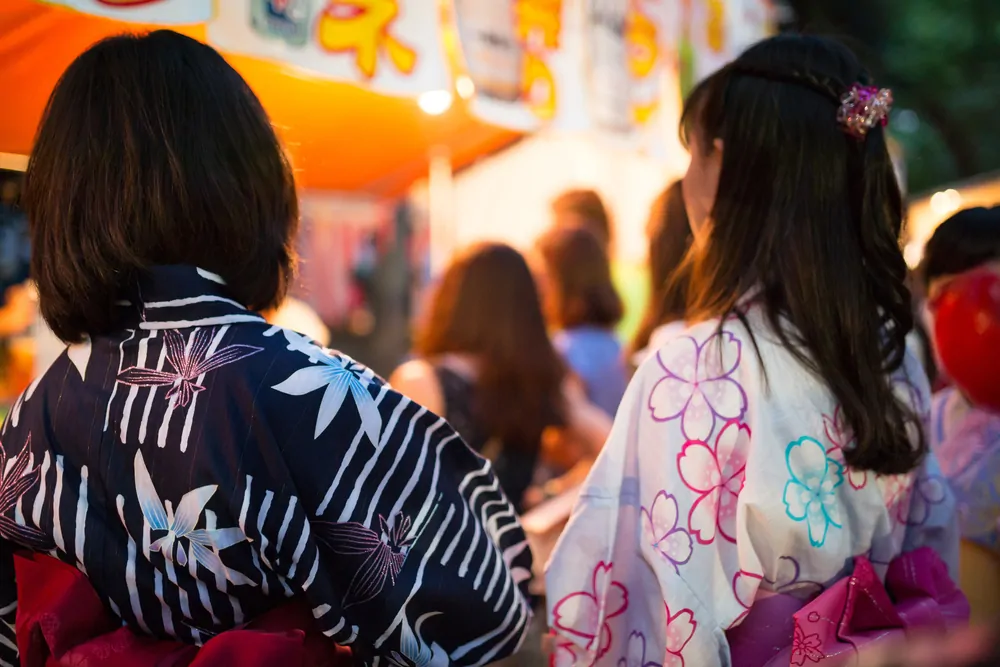 Japanese women wearing a yukata at a matsuri